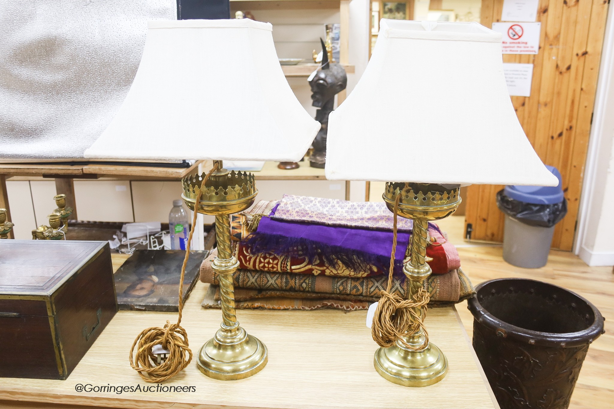 A pair of ecclesiastical brass lamps, later converted, height 37cm